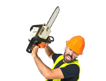 Workman with chainsaw over white backgroundの写真素材