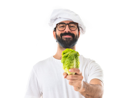 Chef holding a lettuceの写真素材