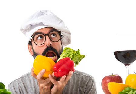 Crazy hipster chef playing with vegetablesの写真素材