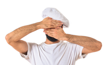 Chef covering his faceの写真素材