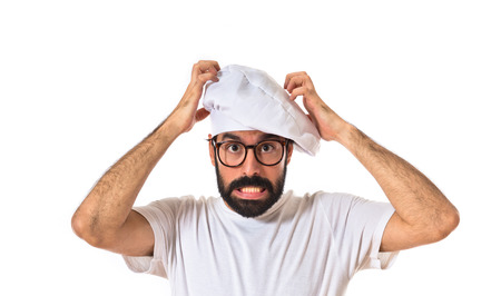 Frustrated chef over white backgroundの写真素材