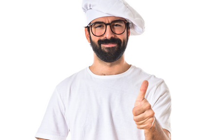 Chef with thumb up over white backgroundの写真素材
