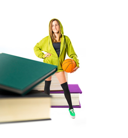 Pretty young girl wearing urban style around booksの写真素材