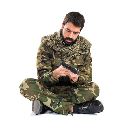 Soldier holding a gunの写真素材