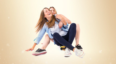 Friends with skate over white backgroundの写真素材