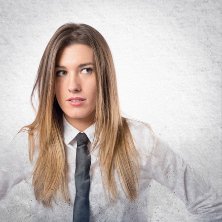 Young businesswoman over isolated white backgroundの写真素材