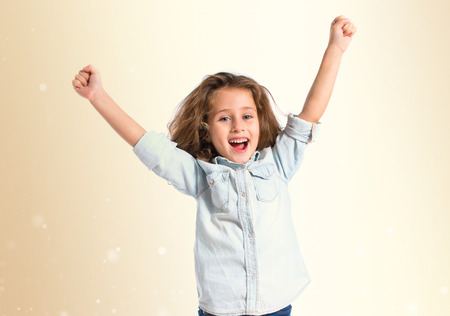 Lucky girl over white backgroundの写真素材