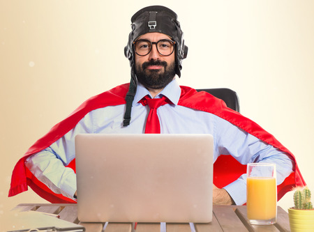 Businessman in his office with pilot hatの写真素材