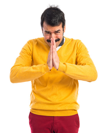 Crazy man pleading over white backgroundの写真素材