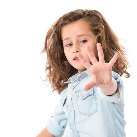 Blonde little girl over whiteの写真素材