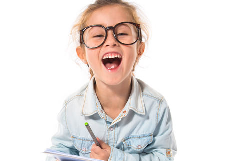 Little girl with glasses studingの写真素材