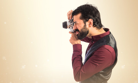 Man wearing waistcoat photographingの写真素材