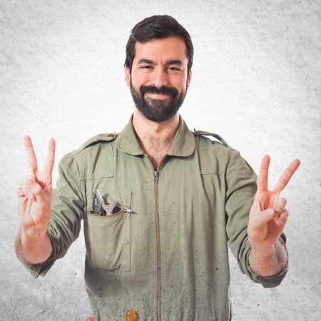 Mechanic doing victory gestureの写真素材