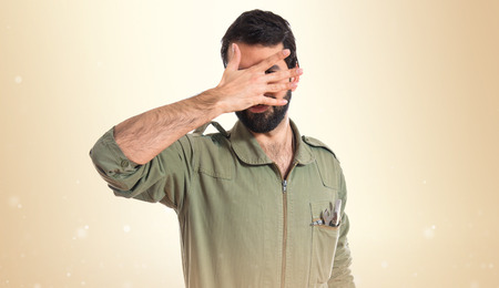 Mechanic covering his faceの写真素材