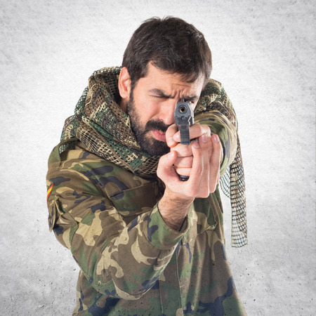 Soldier shooting a gun