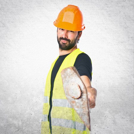 Workman with ax over white backgroundの写真素材
