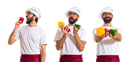 Chef holding colorful peppersの写真素材