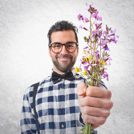 Posh boy with flowersの写真素材