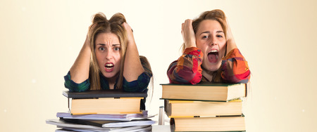 frustrated students over white backgroundの写真素材