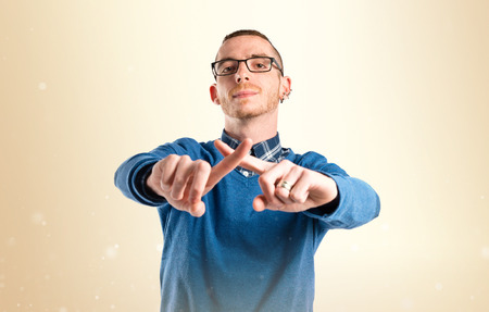 Man doing NO gesture over white backgroundの写真素材