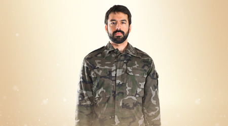 Soldier saluting over white backgroundの写真素材