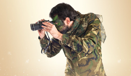 Soldier with binoculars over white backgroundの写真素材