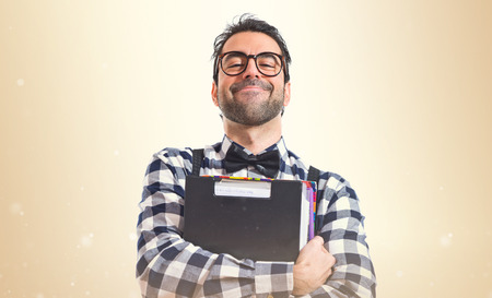 Posh boy holding booksの写真素材