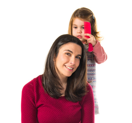 Mother and daughter playing with makeupの写真素材