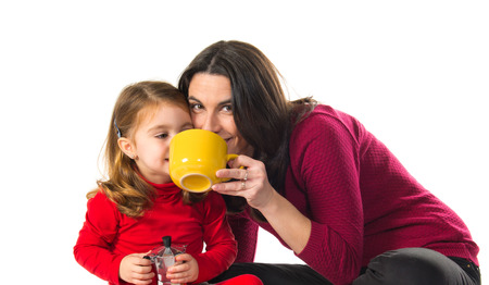 Mother and daughter playing cookingの写真素材