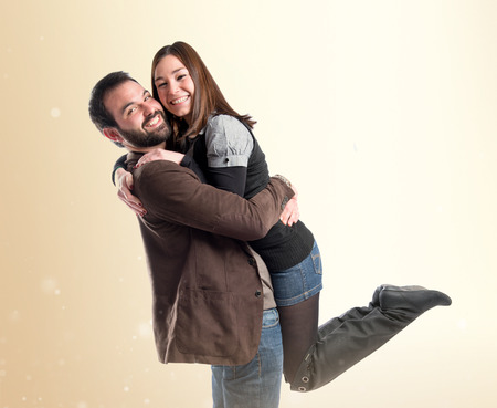 Happy couple over white backgroundの写真素材