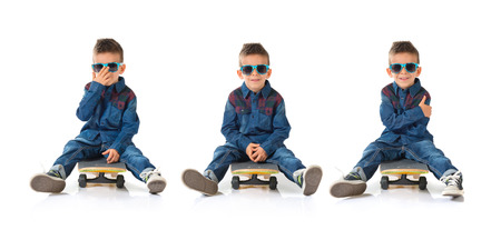 Kid playing with skate boardの写真素材