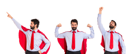 Businessman dressed like superhero with thumb upの写真素材