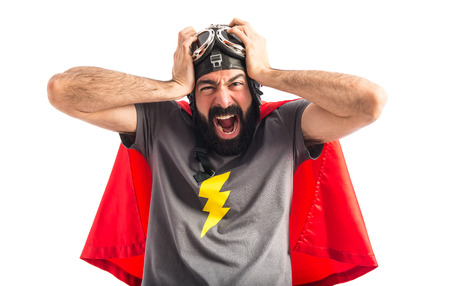 frustrated superhero over white backgroundの写真素材
