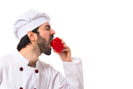 Chef eating red pepperの写真素材
