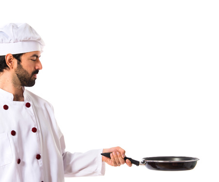 Chef holding frying panの写真素材