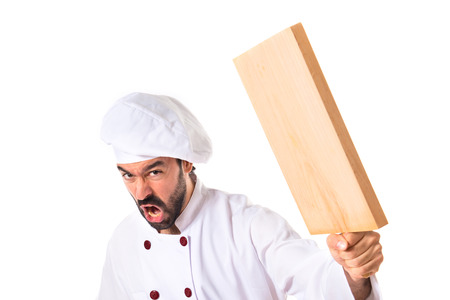 Chef attacking with kitchen toolの写真素材