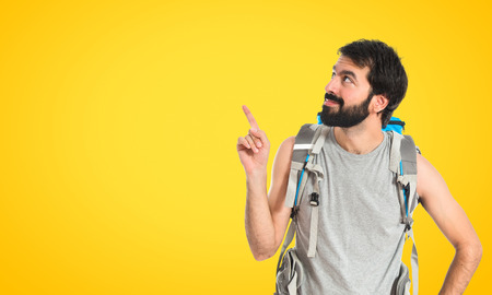 Backpacker thinking over isolated white background