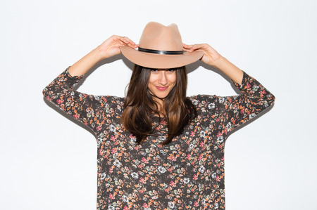 Cute woman with hat in studioの写真素材