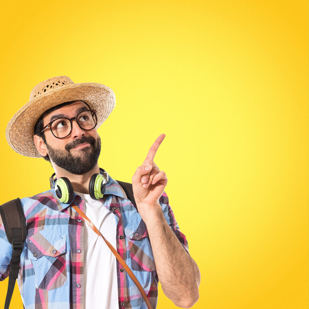 Tourist thinking over white backgroundの写真素材