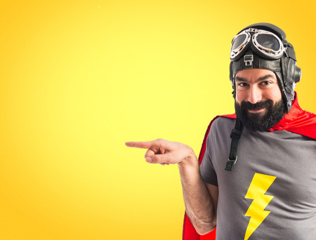 Superhero pointing to the lateralの写真素材