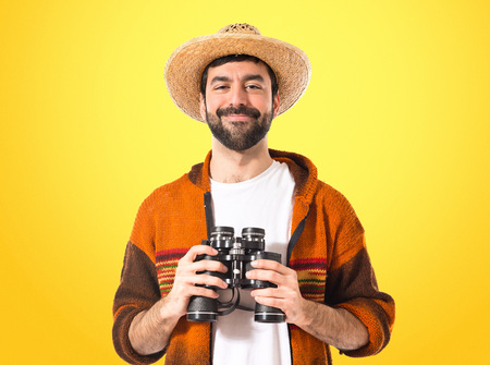 Tourist with binoculars over white backgroundの写真素材