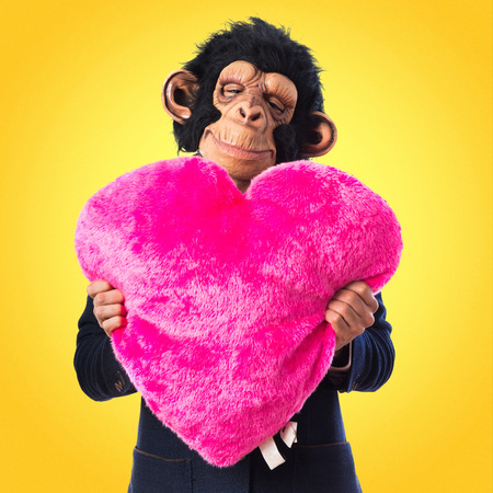 Monkey man holding a big heartの写真素材