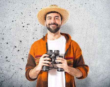 Tourist with binoculars over white backgroundの写真素材
