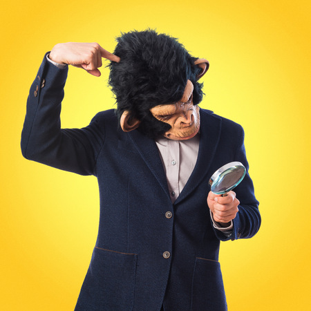 Monkey man with magnifying glass