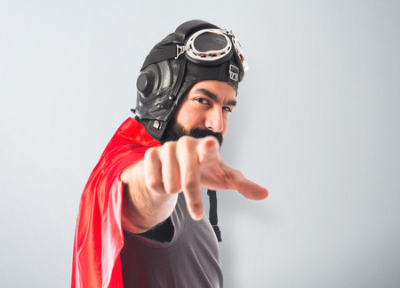 Superhero pointing to the frontの写真素材