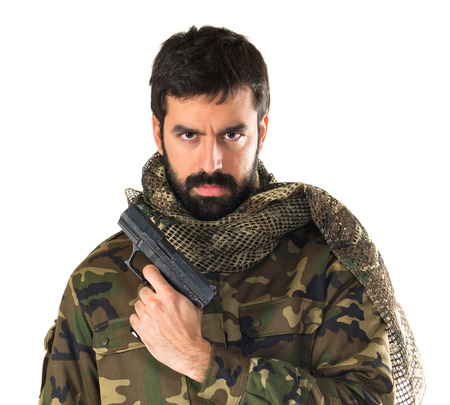 Soldier holding a gunの写真素材