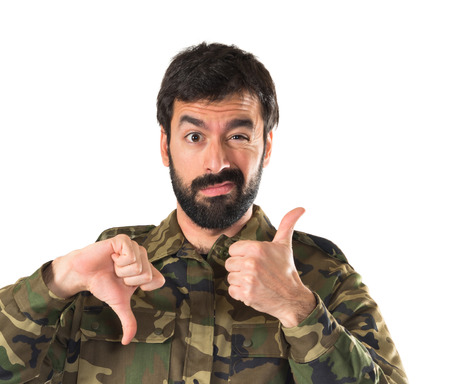 Soldier making good-bad signの写真素材