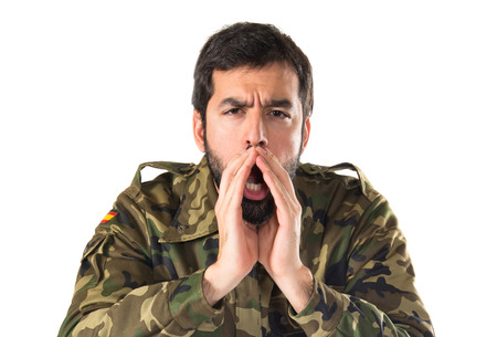 Soldier shouting over white backgroundの写真素材