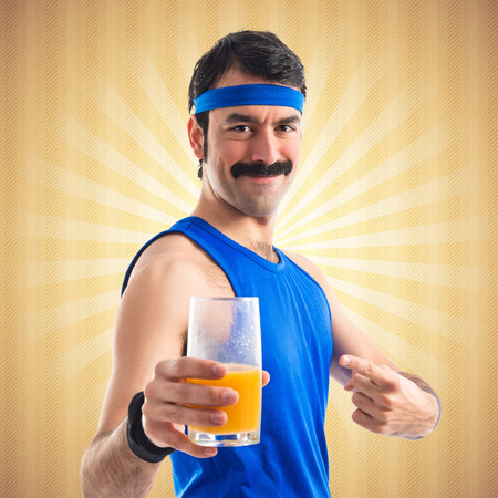 Vintage sportman with orange juiceの写真素材