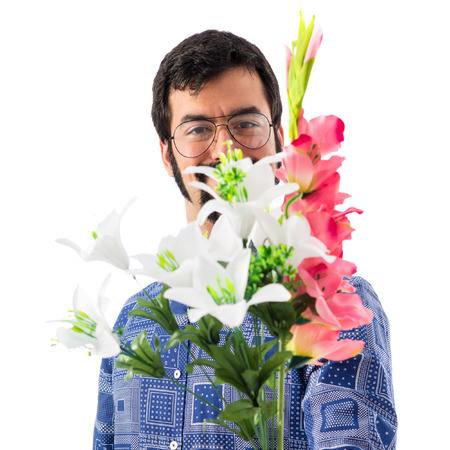 Vintage young man holding flowersの写真素材